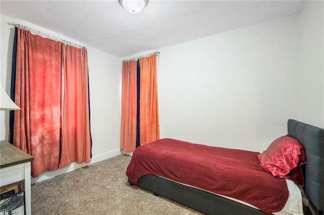 bedroom with light colored carpet