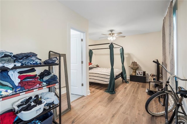 bedroom featuring light hardwood / wood-style flooring and ceiling fan