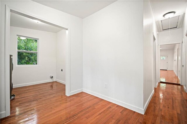 4 Straight St, Mobile, AL 36604 - unfurnished room with hardwood / wood-style floors, attic access, and baseboards
