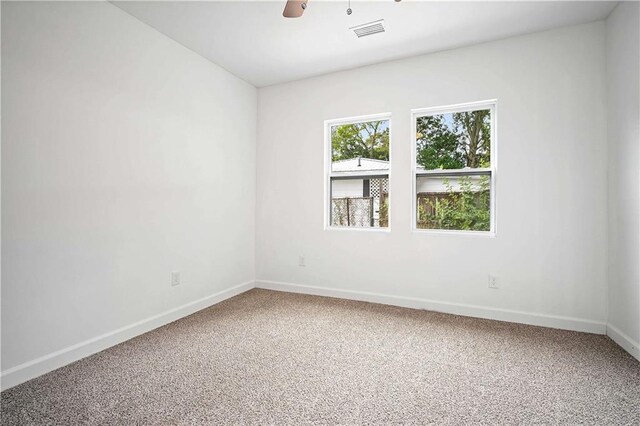 4 Straight St, Mobile, AL 36604 - carpeted spare room with baseboards, visible vents, and a ceiling fan