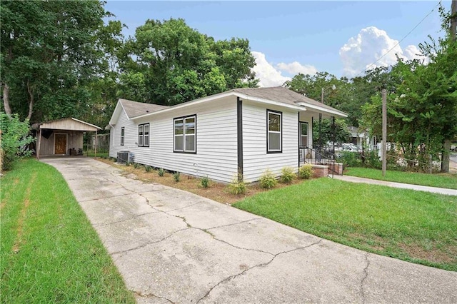 4 Straight St, Mobile, AL 36604 - view of front of property with an outbuilding, driveway, a front lawn, and cooling unit