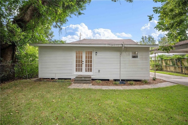 4 Straight St, Mobile, AL 36604 - rear view of house with a carport, a yard, french doors, and fence