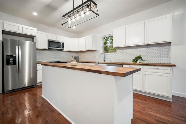 4 Straight St, Mobile, AL 36604 - kitchen featuring appliances with stainless steel finishes, a kitchen island, wood counters, and white cabinets