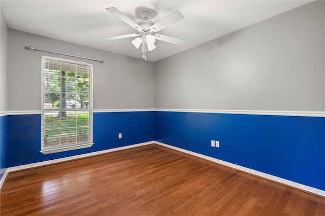 405 Baker Rd, Satsuma, AL 36572 - empty room featuring wood finished floors, baseboards, and a ceiling fan