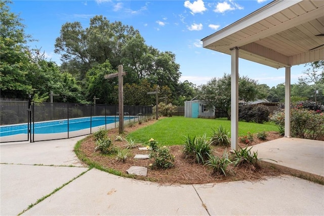 405 Baker Rd, Satsuma, AL 36572 - view of yard with an outbuilding, a patio, and view of wooded area