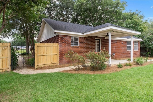 405 Baker Rd, Satsuma, AL 36572 - view of side of home with ceiling fan and brick siding