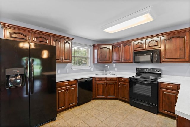 405 Baker Rd, Satsuma, AL 36572 - kitchen with black appliances, a sink, and light countertops