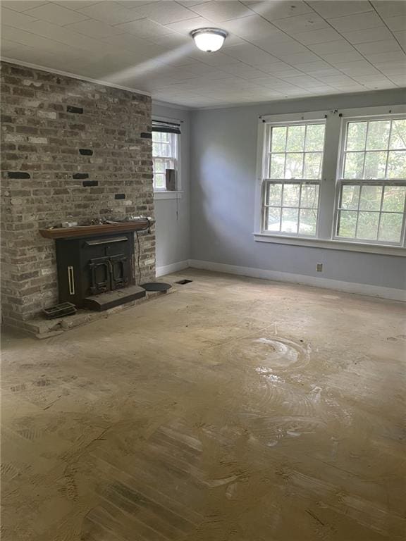 2065 Magnolia Ln, Mobile, AL 36605 - unfurnished living room featuring baseboards and a fireplace