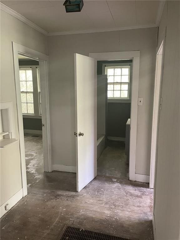 2065 Magnolia Ln, Mobile, AL 36605 - hall featuring crown molding, plenty of natural light, and baseboards
