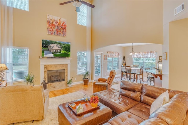 10808 Legacy Ln, Mobile, AL 36608 - living room with a towering ceiling, arched walkways, healthy amount of natural light, wood finished floors, and ceiling fan