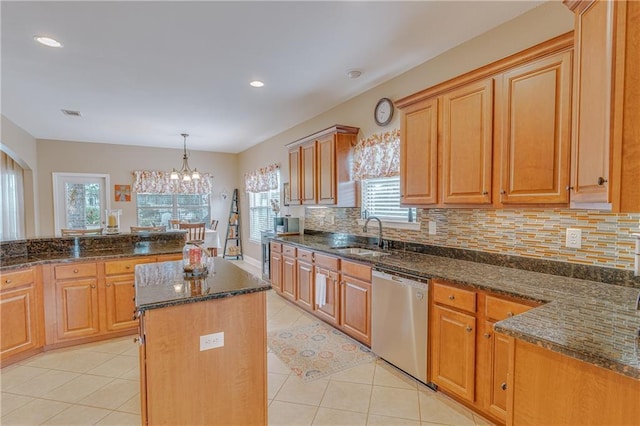 10808 Legacy Ln, Mobile, AL 36608 - kitchen with stainless steel dishwasher, plenty of natural light, dark stone counters, light tile patterned flooring, and recessed lighting