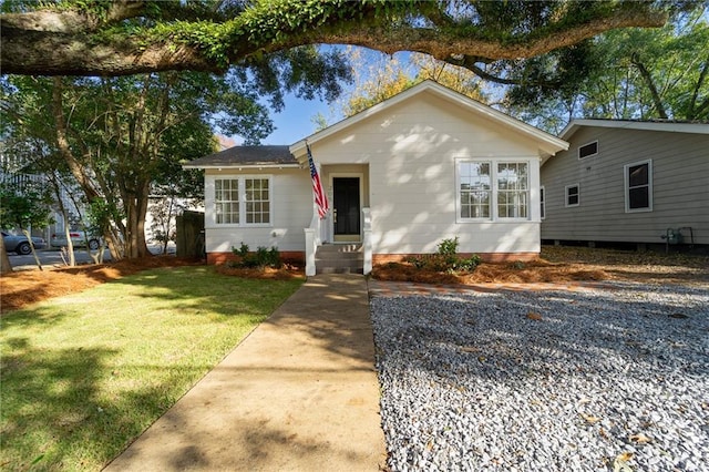 view of front of home with a front lawn