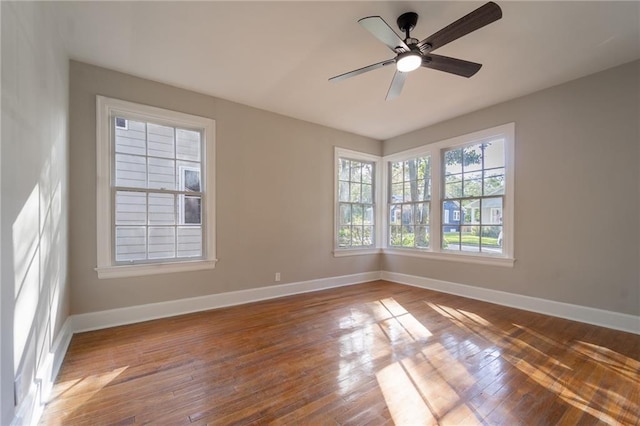 spare room featuring ceiling fan and wood-type flooring