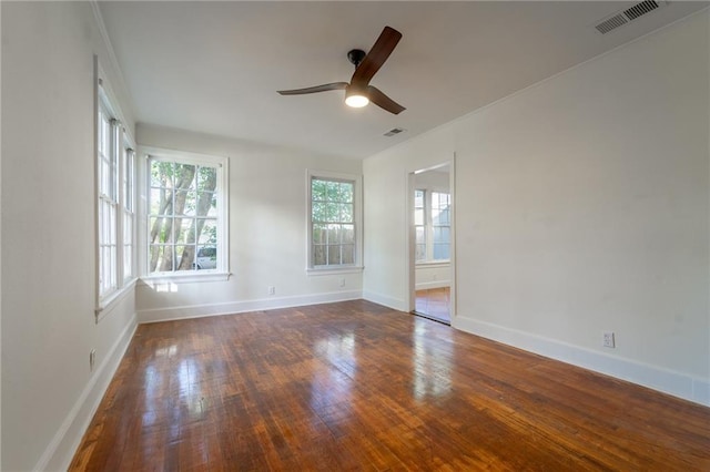 unfurnished room featuring ceiling fan and dark wood-type flooring