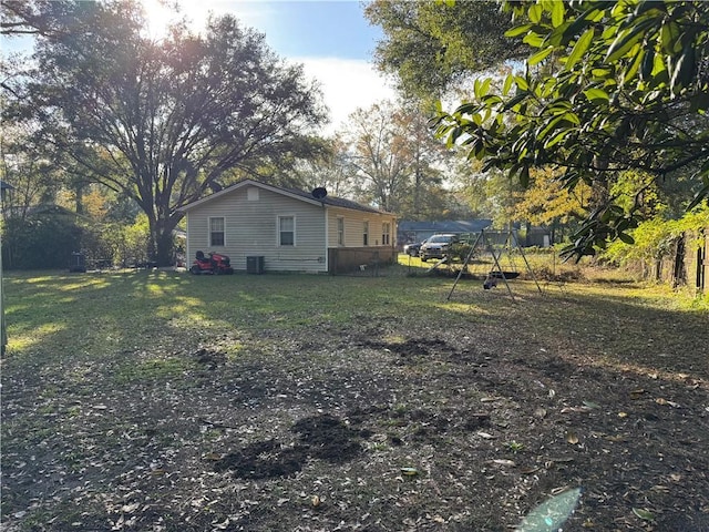 view of yard with central air condition unit