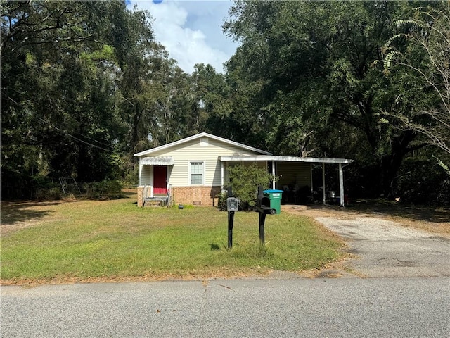 view of outbuilding featuring a yard and a carport