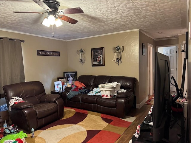 living room with ceiling fan, crown molding, and hardwood / wood-style flooring