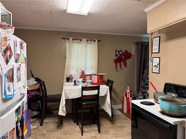 dining space with crown molding