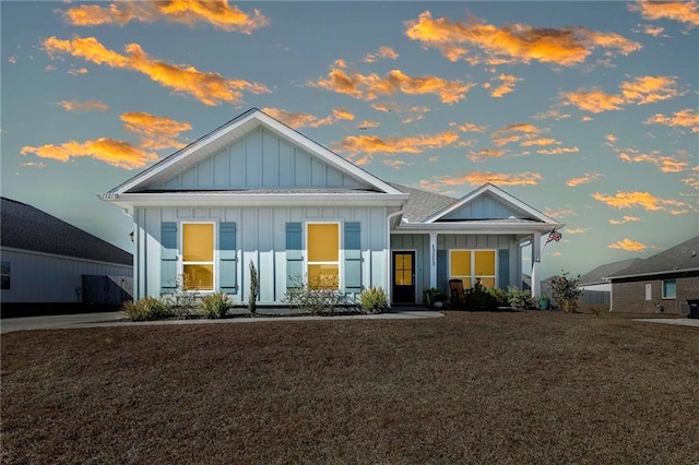 craftsman-style home with a yard