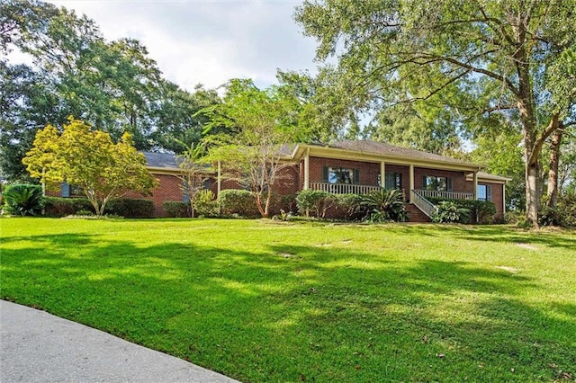 ranch-style home featuring a front lawn