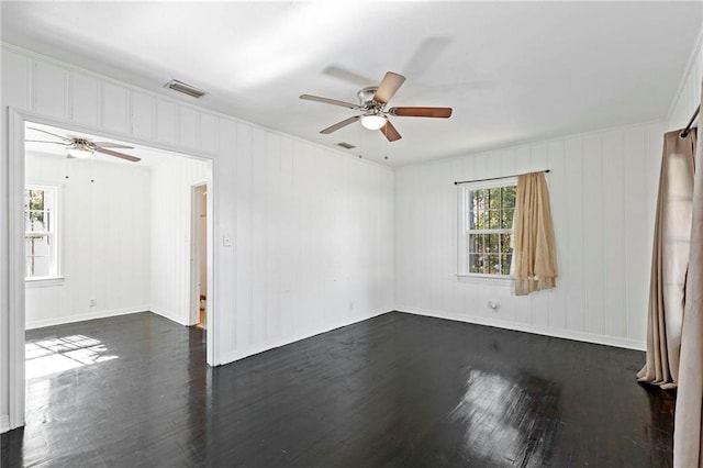 unfurnished room with dark hardwood / wood-style floors