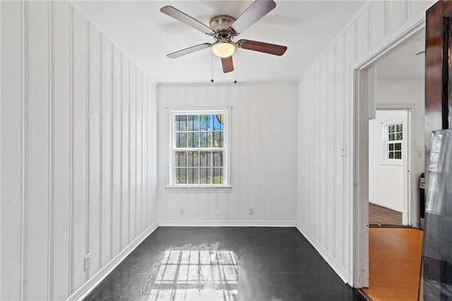 spare room featuring crown molding and ceiling fan