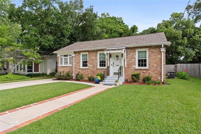 1910 Hunter Ave, Mobile, AL 36606 - view of front facade with brick siding, central AC, and a shingled roof