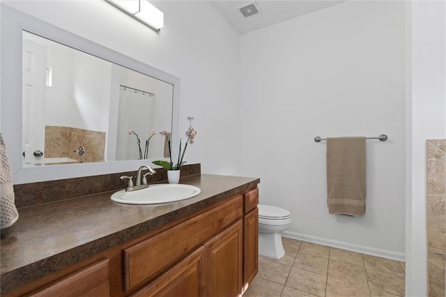 1910 Hunter Ave, Mobile, AL 36606 - bathroom featuring vanity, toilet, baseboards, tile patterned floors, and a bathtub