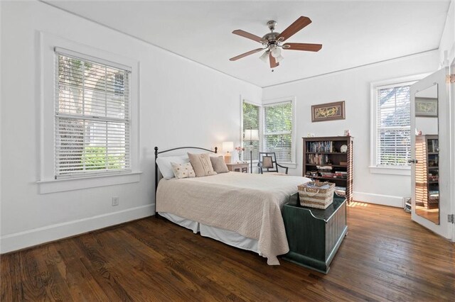 1910 Hunter Ave, Mobile, AL 36606 - bedroom featuring baseboards, multiple windows, dark wood finished floors, and ceiling fan