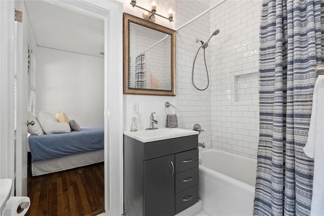1910 Hunter Ave, Mobile, AL 36606 - ensuite bathroom featuring shower / bathtub combination with curtain, vanity, wood finished floors, and toilet