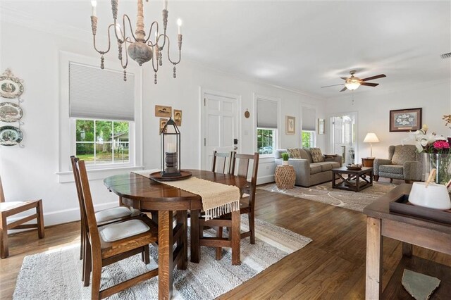 1910 Hunter Ave, Mobile, AL 36606 - dining area with healthy amount of natural light, ceiling fan, light wood-type flooring, and crown molding