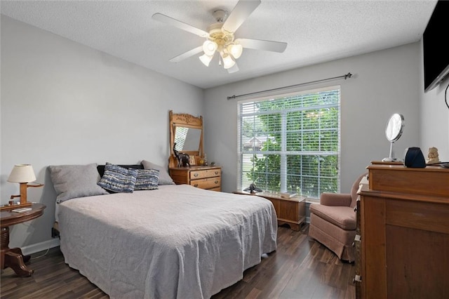 1521 Peyton Dr E, Mobile, AL 36695 - bedroom featuring dark wood-style floors, a textured ceiling, and ceiling fan