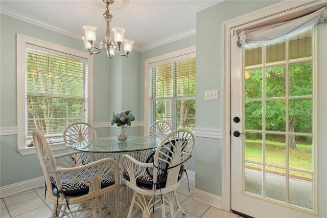 1521 Peyton Dr E, Mobile, AL 36695 - dining area featuring tile patterned flooring, a chandelier, baseboards, and crown molding