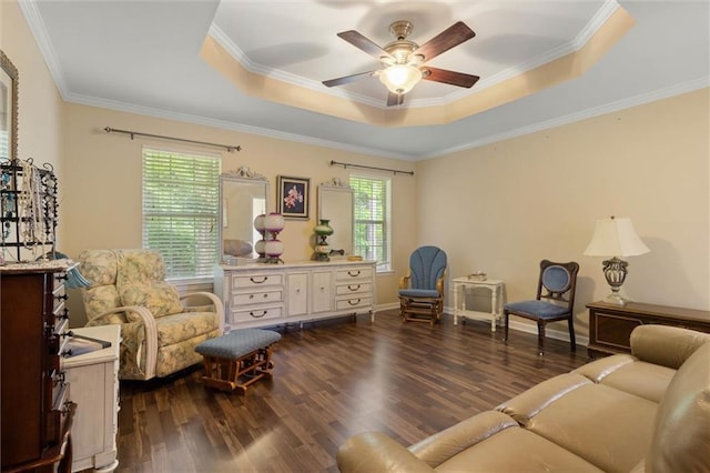 1521 Peyton Dr E, Mobile, AL 36695 - living area with a raised ceiling, dark wood-style flooring, a ceiling fan, and crown molding