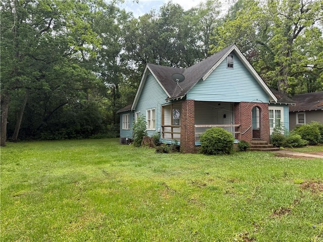 view of front of property with a porch and a front yard