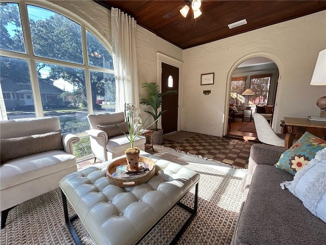 living room with a healthy amount of sunlight and wood ceiling