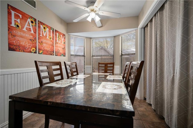 tiled dining room with ceiling fan