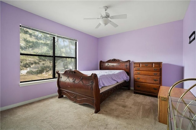 bedroom with light colored carpet and ceiling fan