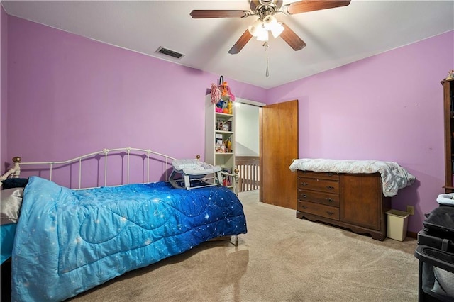 bedroom with ceiling fan and carpet flooring