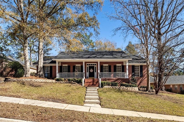 single story home with a porch and a front yard