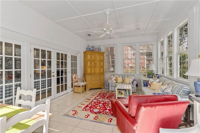 sunroom with french doors and tile patterned flooring