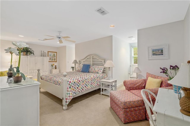 bedroom featuring light colored carpet, ceiling fan, and recessed lighting