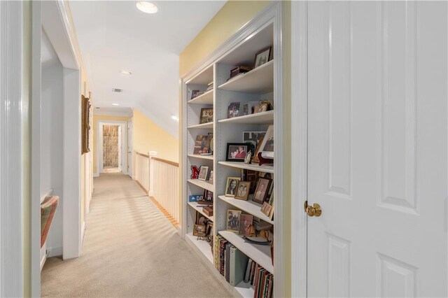 hallway with light carpet and recessed lighting