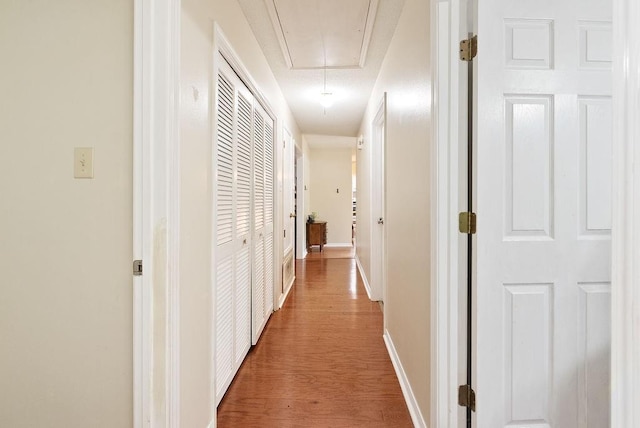 2808 Westmoor Ct, Mobile, AL 36695 - corridor featuring attic access, wood finished floors, and baseboards