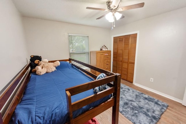 2808 Westmoor Ct, Mobile, AL 36695 - bedroom with wood finished floors, a closet, baseboards, and a ceiling fan