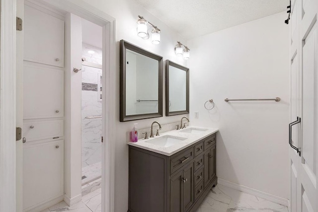 2808 Westmoor Ct, Mobile, AL 36695 - full bathroom with marble finish floors, baseboards, a tile shower, and double vanity