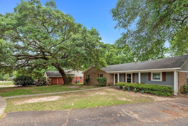 2808 Westmoor Ct, Mobile, AL 36695 - ranch-style home with a front lawn and brick siding