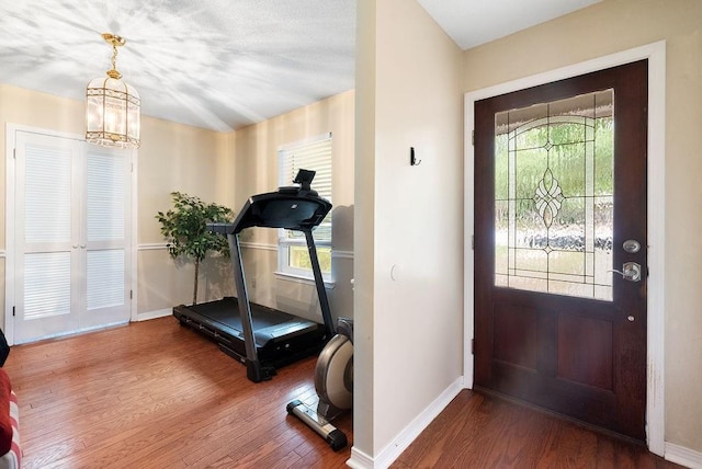 2808 Westmoor Ct, Mobile, AL 36695 - foyer with a chandelier, wood finished floors, and baseboards