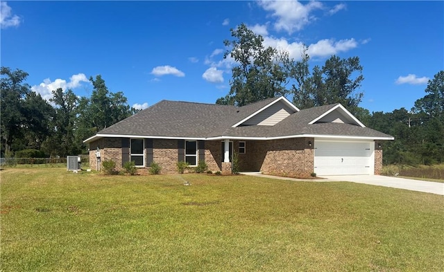 9198 Ofallon Dr N, Mobile, AL 36695 - view of front facade with brick siding, an attached garage, central AC, and driveway