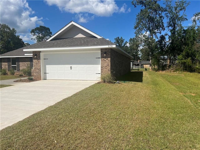 9198 Ofallon Dr N, Mobile, AL 36695 - view of side of home with brick siding, an attached garage, a yard, concrete driveway, and a shingled roof